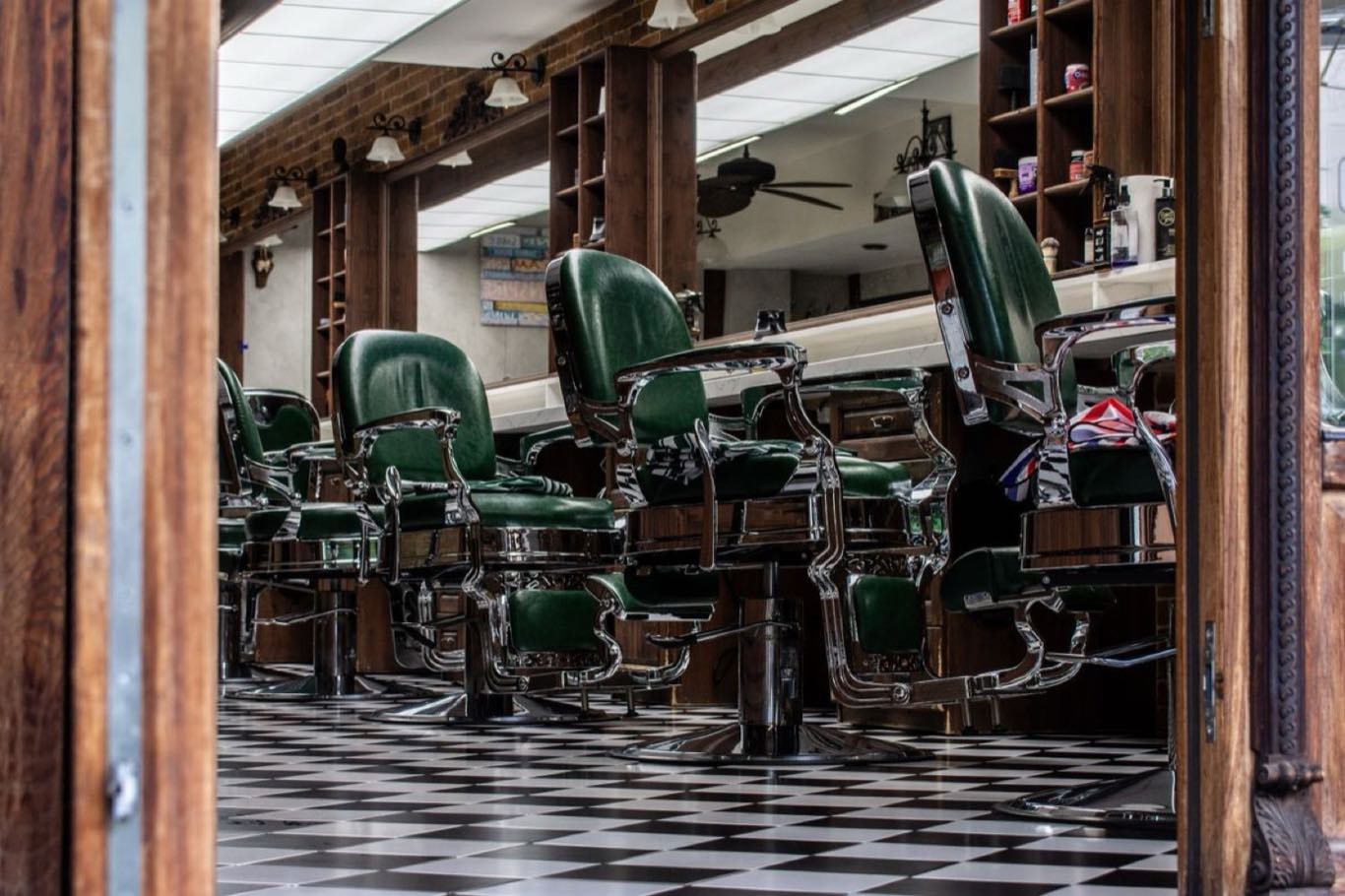 A vintage barbershop interior with classic chairs and a checkered floor