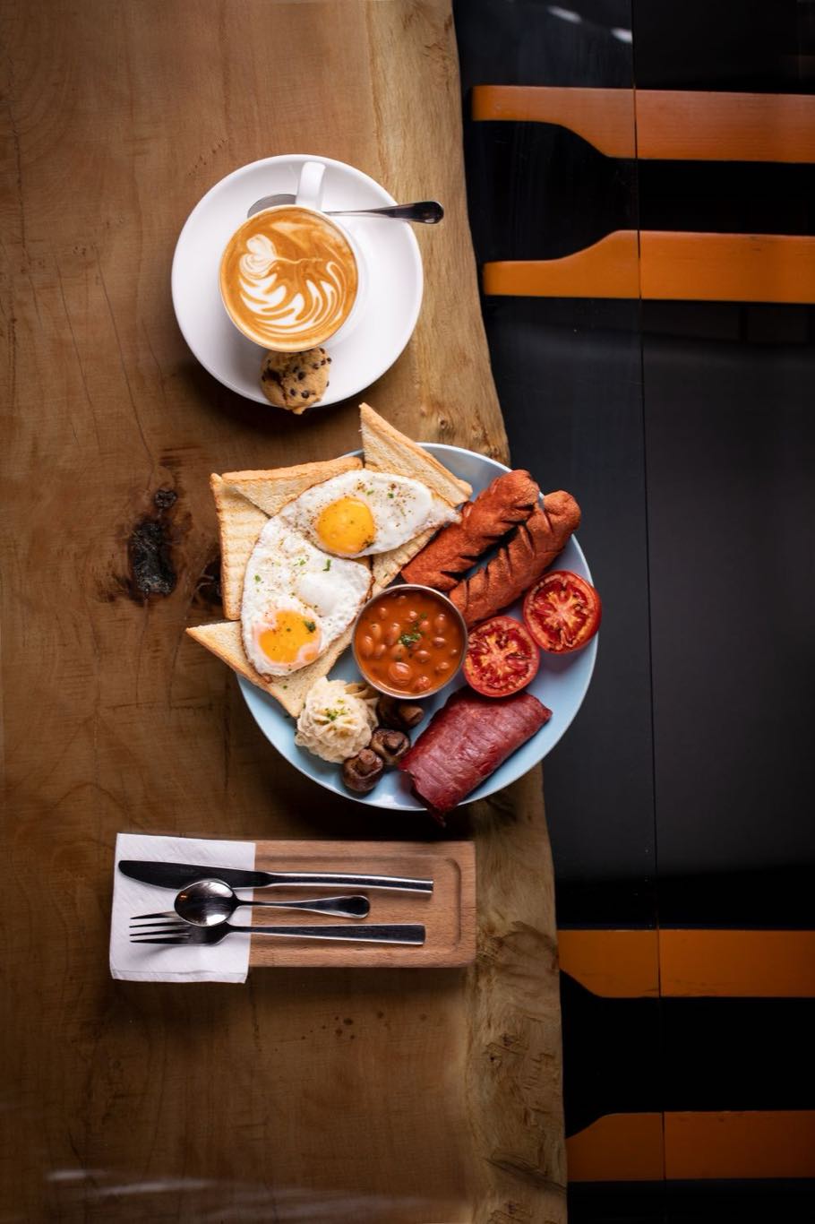 A cooked breakfast on a rustic plate